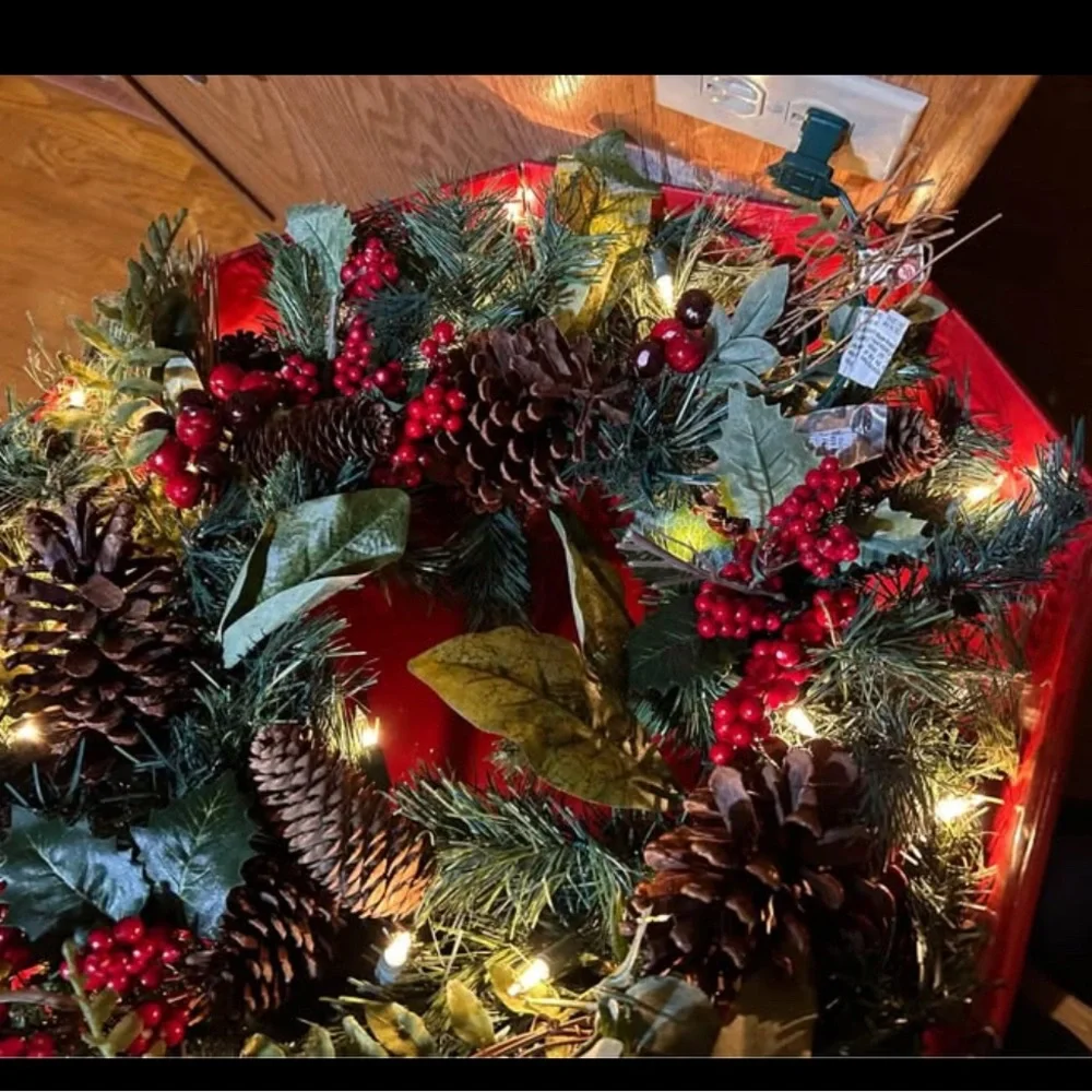 Christmas Holiday Wreath with Pinecones, red berries, white lights.